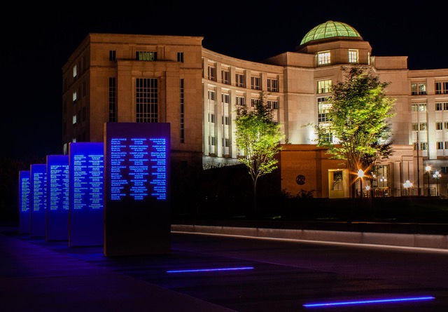 MLEOM - West Side of plaza at night with Michigan Hall of Justice